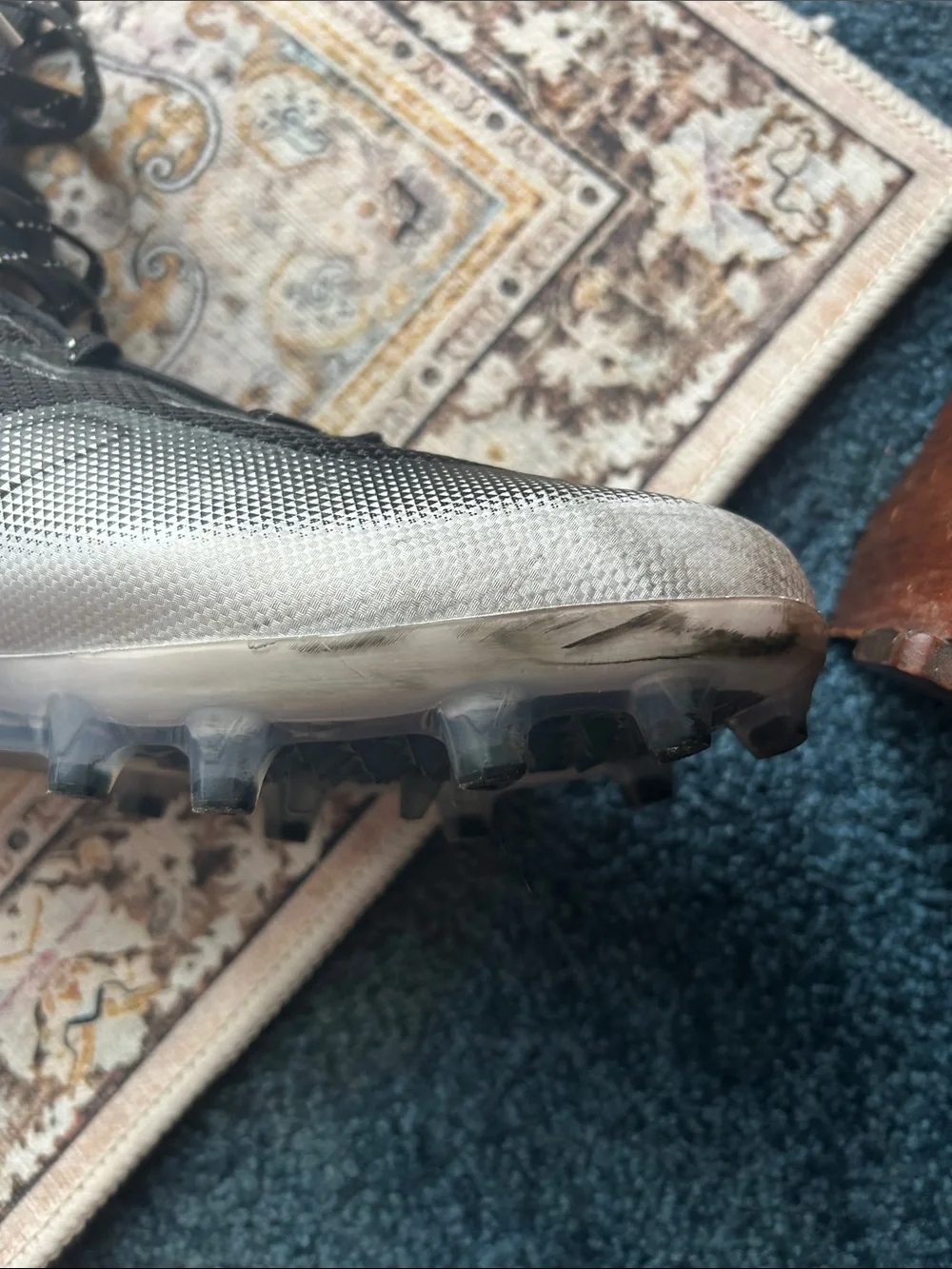 Under Armour Black and Silver High-Top Athletic cleats